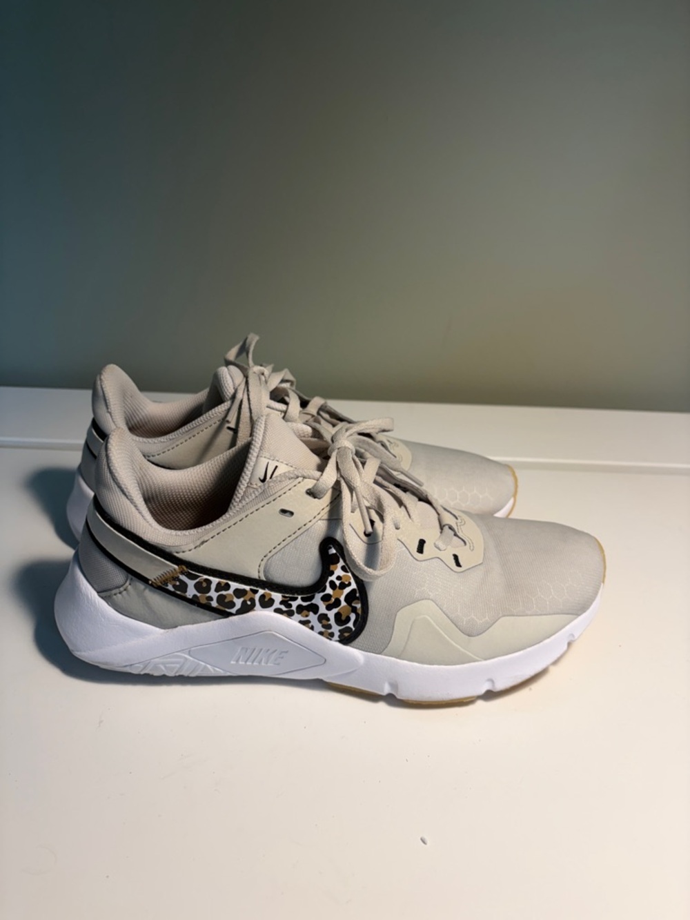 Nike Women's Legend Essential 2 Sneakers with Leopard Swoosh